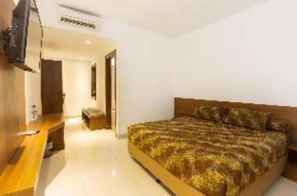 Bed in Hotel Adilla Syariah Ambarukmo