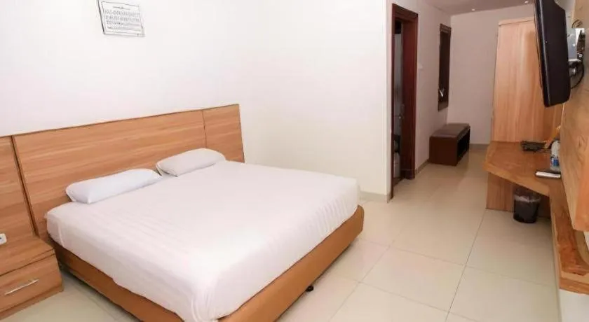 Bed in Hotel Adilla Syariah Ambarukmo