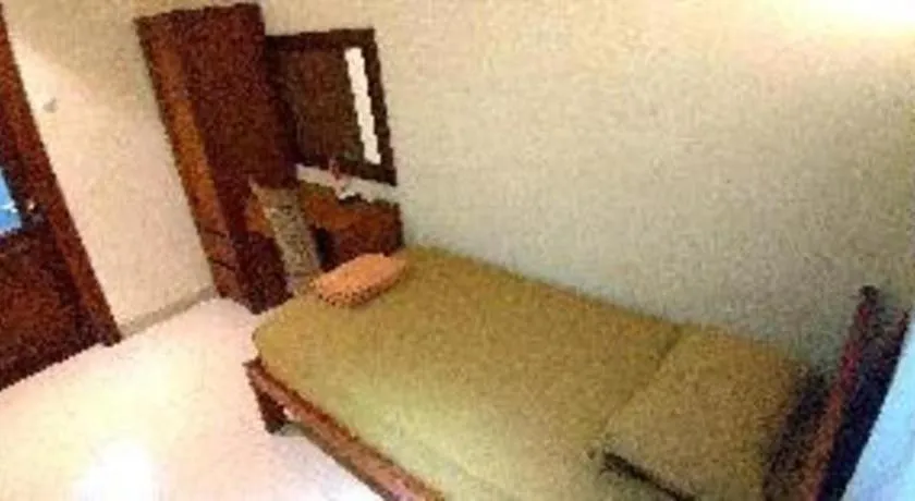Bed in Hotel Adilla Syariah Ambarukmo