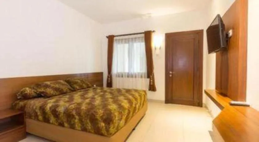 Bed in Hotel Adilla Syariah Ambarukmo