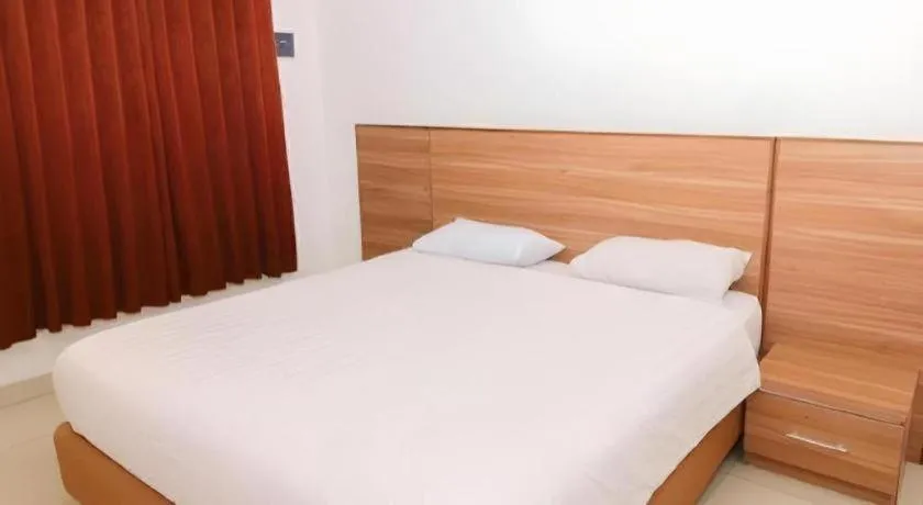 Bed in Hotel Adilla Syariah Ambarukmo