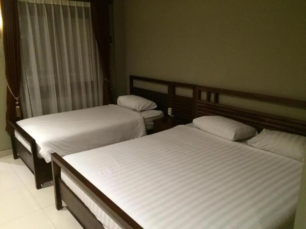 Bed in Hotel Adilla Syariah Ambarukmo
