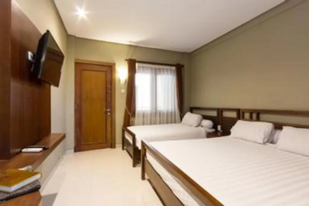 Bed in Hotel Adilla Syariah Ambarukmo