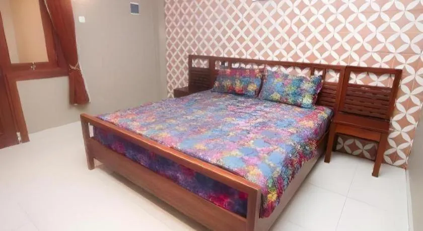Bed in Hotel Adilla Syariah Ambarukmo