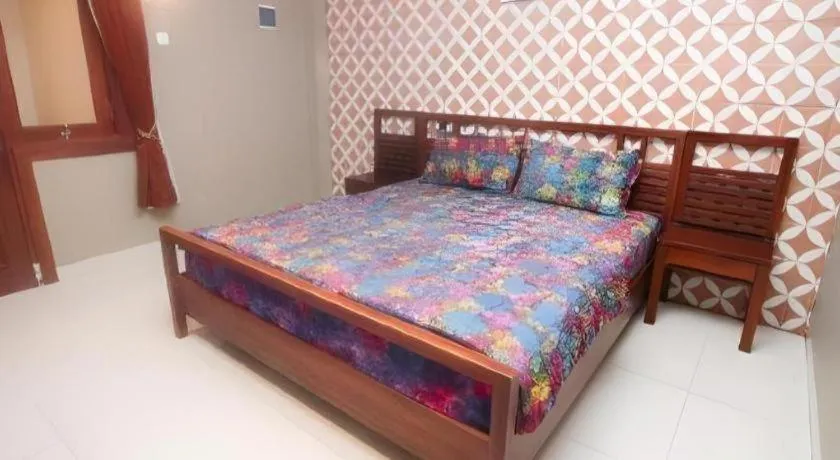 Bed in Hotel Adilla Syariah Ambarukmo
