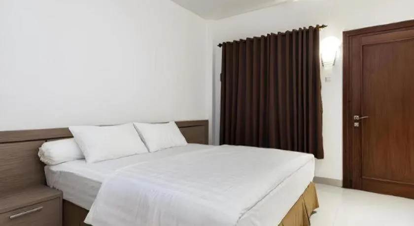 Bed in Hotel Adilla Syariah Ambarukmo