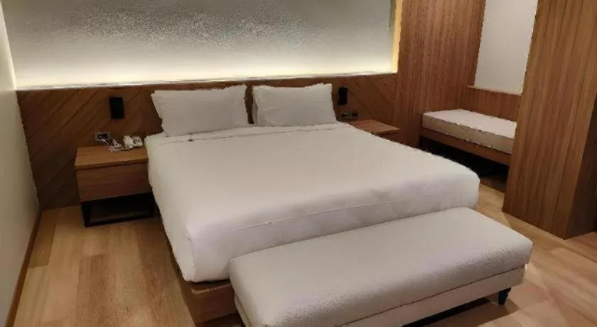 Bed in Butterfly Princess Hotel