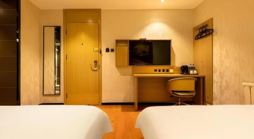 Bed in IU Hotel Tianjin Xiqing Zhong Bei Zhen Branch