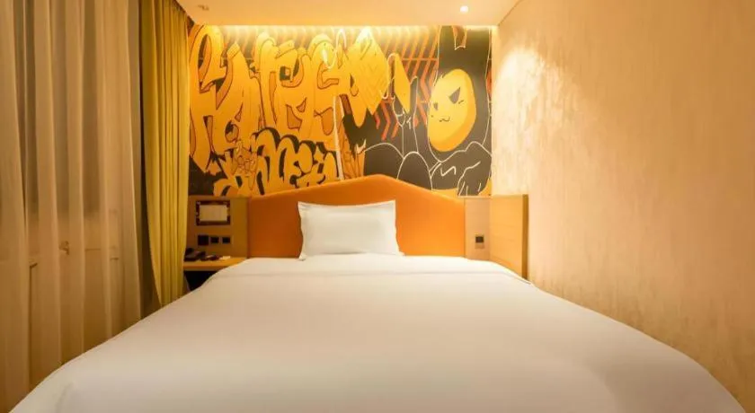 Bed in IU Hotel Tianjin Xiqing Zhong Bei Zhen Branch