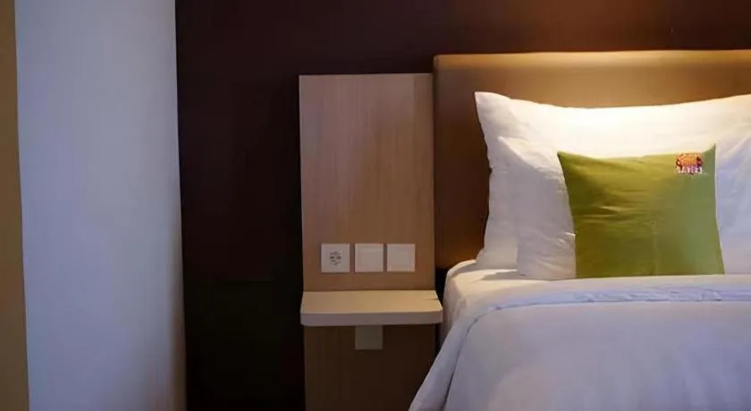 Bed in Hotel Dafam Pacific Caesar