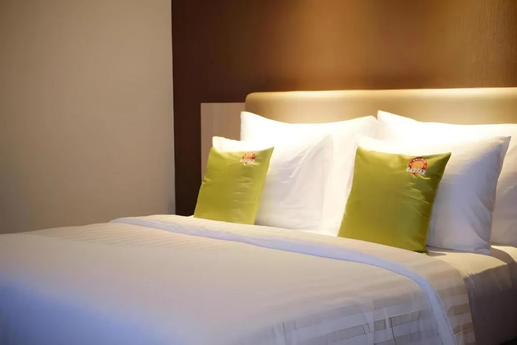 Bed in Hotel Dafam Pacific Caesar