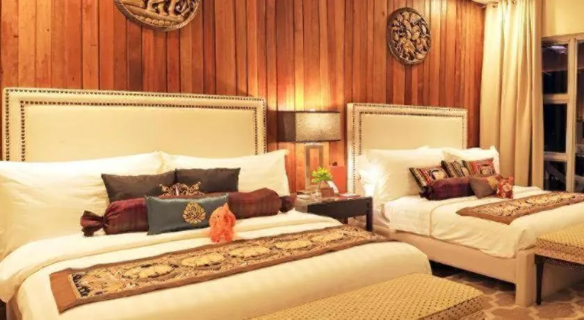 Bed in The Oriental Luxury Suites Tagaytay