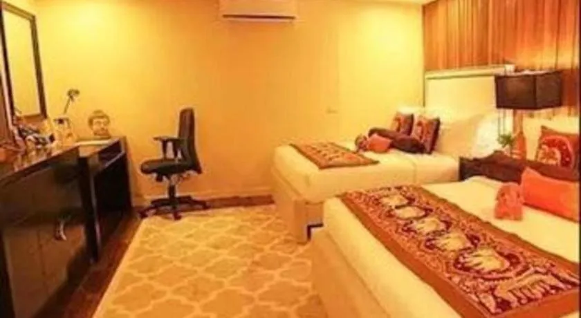 Bed in The Oriental Luxury Suites Tagaytay