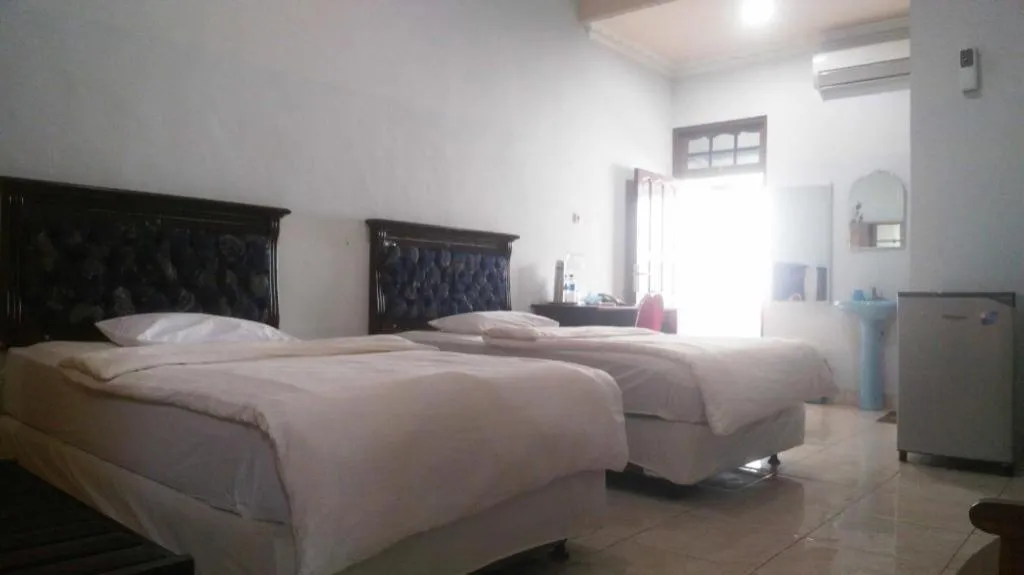 Bed in Avicenna Hotel