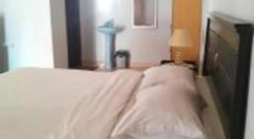 Bed in Avicenna Hotel