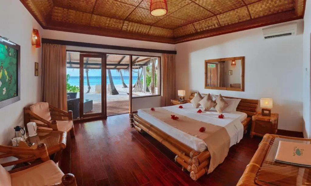 Bed in Angaga Island Resort and Spa