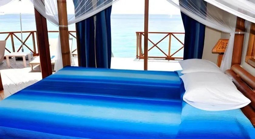 Bed in Angaga Island Resort and Spa
