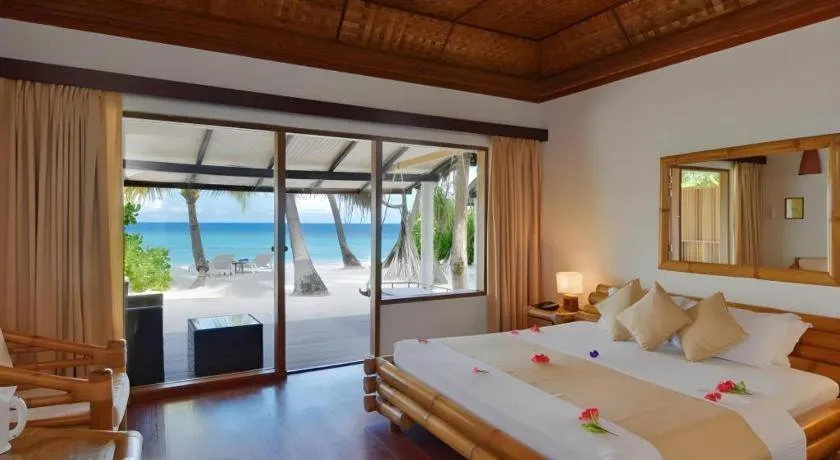 Bed in Angaga Island Resort and Spa