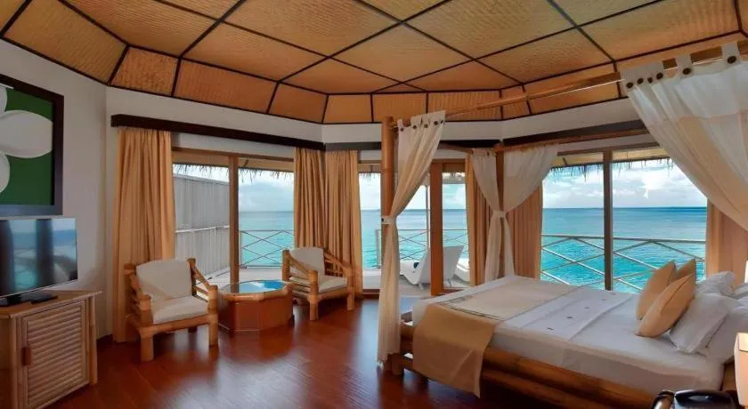 Bed in Angaga Island Resort and Spa