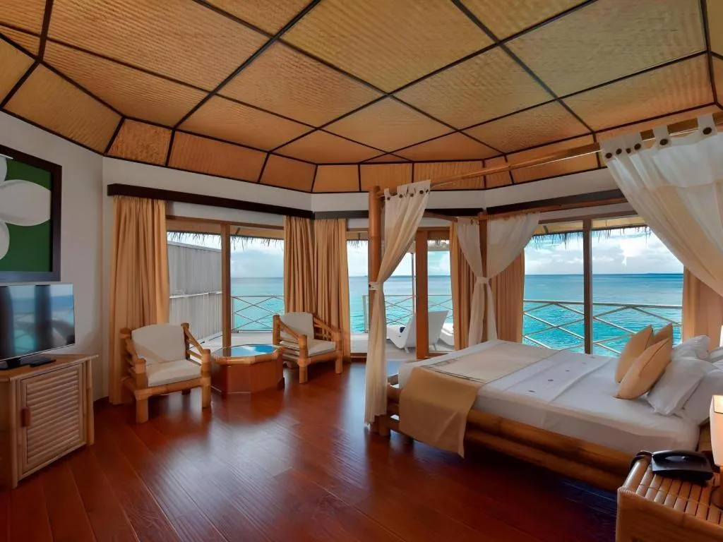 Bed in Angaga Island Resort and Spa