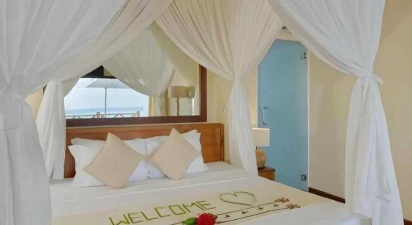 Bed in Angaga Island Resort and Spa