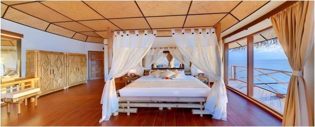 Bed in Angaga Island Resort and Spa