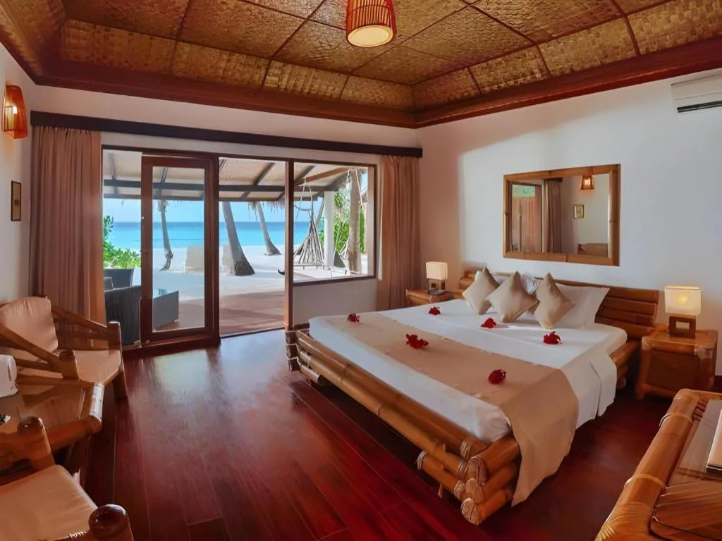 Bed in Angaga Island Resort and Spa