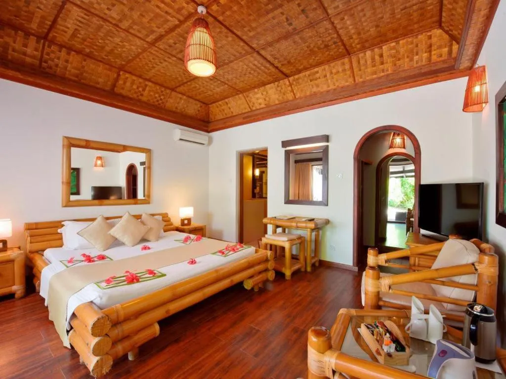 Bed in Angaga Island Resort and Spa