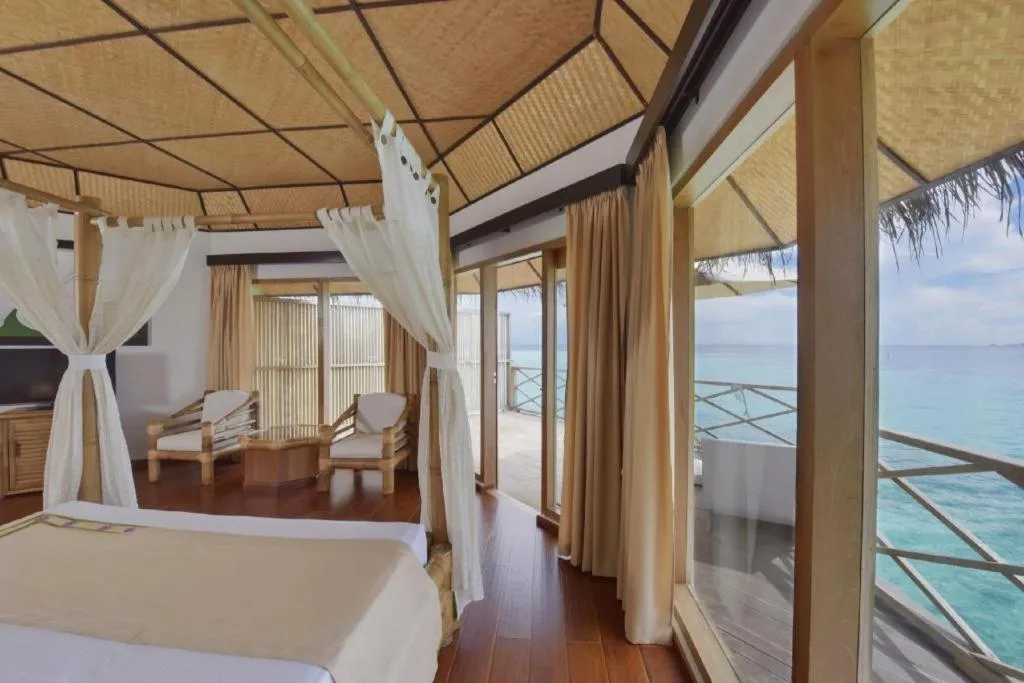 Bed in Angaga Island Resort and Spa
