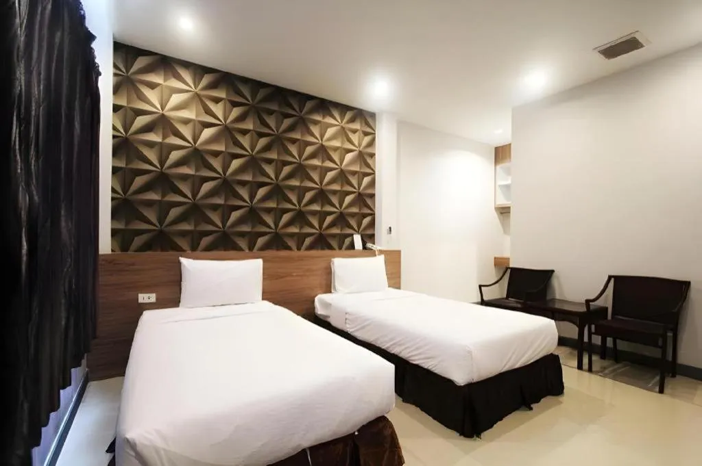 Bed in Seree Grand Resort