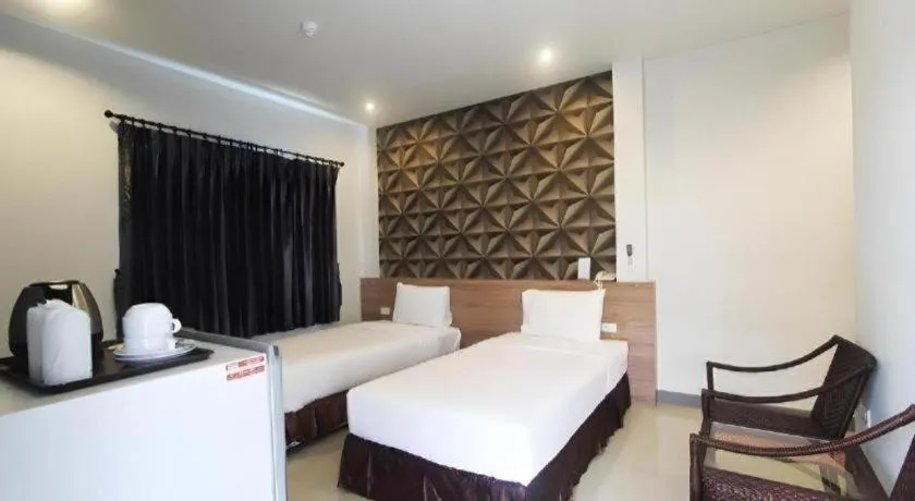 Bed in Seree Grand Resort