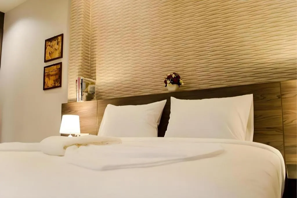 Bed in Seree Grand Resort