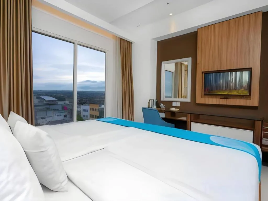 Bed in Java Lotus Hotel Jember