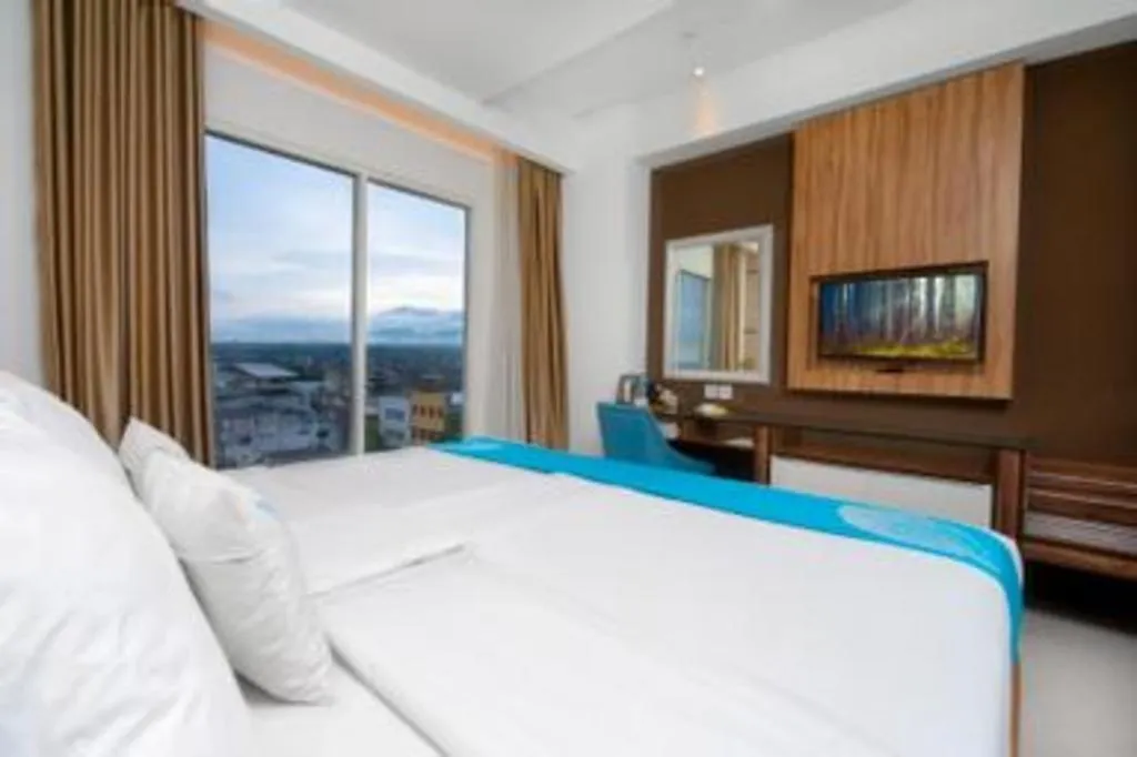 Bed in Java Lotus Hotel Jember