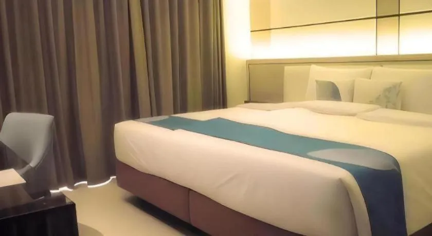 Bed in Java Lotus Hotel Jember