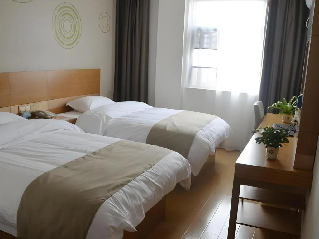 Bed in GreenTree Inn Anqing Wangjiang County Lantian Road Yiheyuan Express Hotel