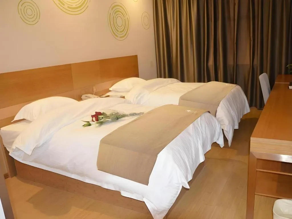 Bed in GreenTree Inn Anqing Wangjiang County Lantian Road Yiheyuan Express Hotel