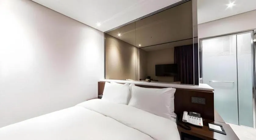 Bed in CS Premier Hotel