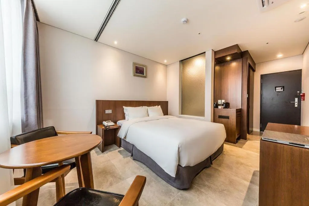 Bed in CS Premier Hotel