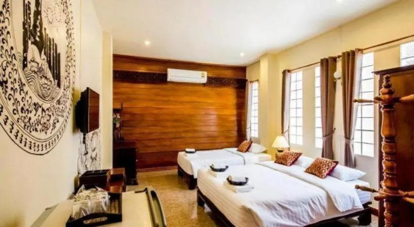 Bed in Wake Up at Muang Kao Boutique Hotel