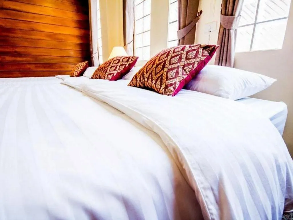 Bed in Wake Up at Muang Kao Boutique Hotel