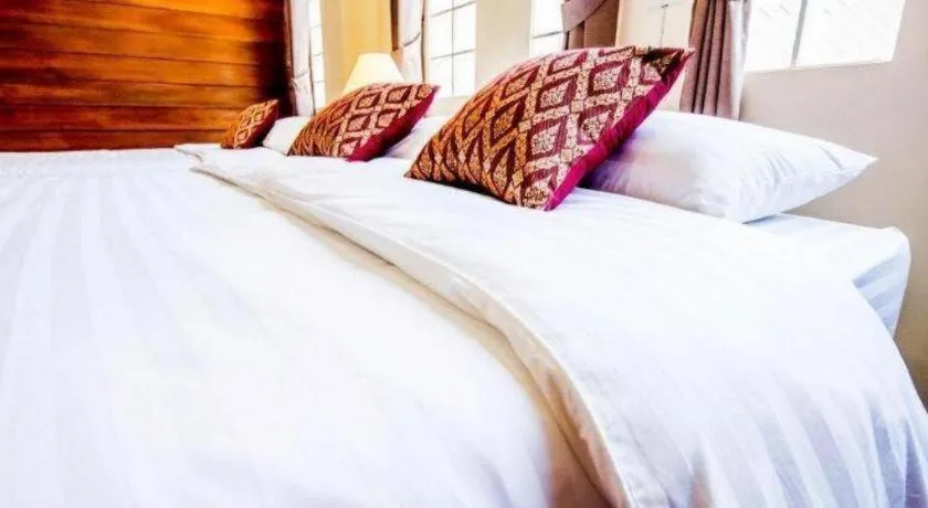 Bed in Wake Up at Muang Kao Boutique Hotel