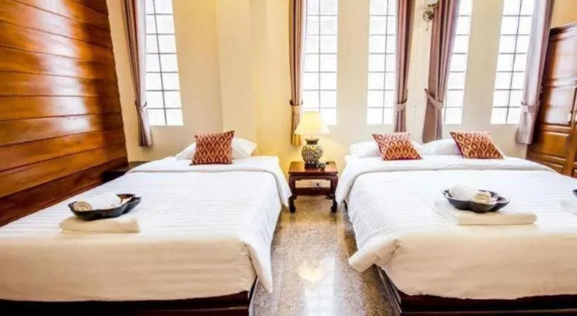 Bed in Wake Up at Muang Kao Boutique Hotel