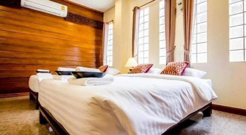 Bed in Wake Up at Muang Kao Boutique Hotel