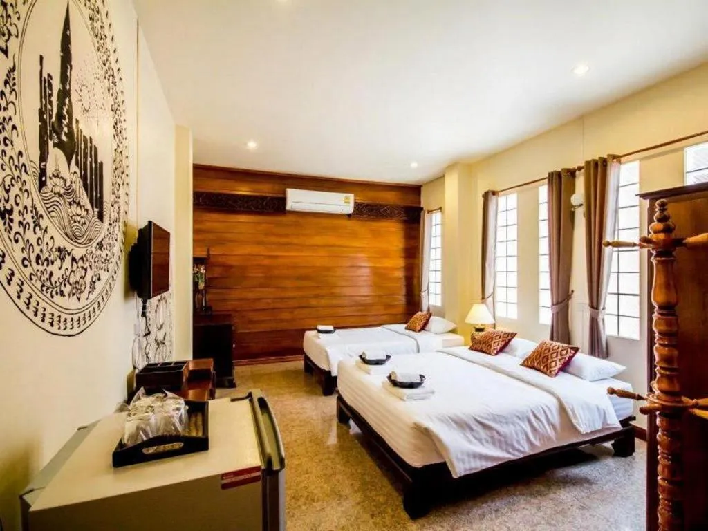 Bed in Wake Up at Muang Kao Boutique Hotel