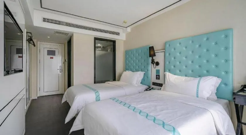 Bed in Xana Hotelle Beijing Qianmen Footbridge Metro Station