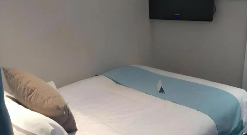 Bed in Xana Hotelle Beijing Qianmen Footbridge Metro Station