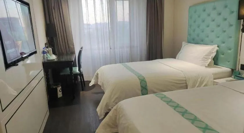 Bed in Xana Hotelle Beijing Qianmen Footbridge Metro Station