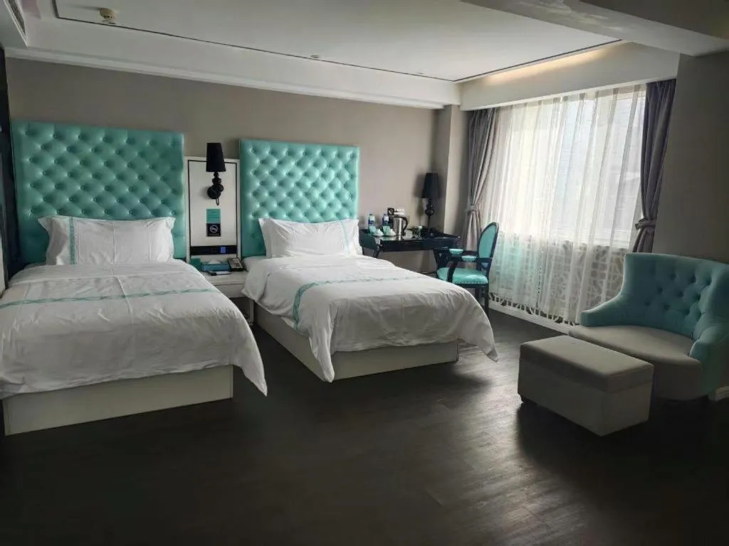 Bed in Xana Hotelle Beijing Qianmen Footbridge Metro Station