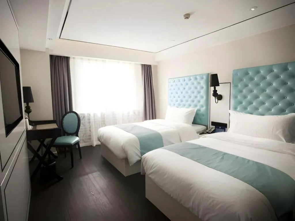 Bed in Xana Hotelle Beijing Qianmen Footbridge Metro Station